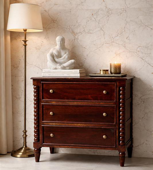 Elegant wooden dresser with lamp and decor